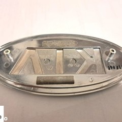 KIA RIO III 11- EMBLEMAT ZDERZAKA 863201W000